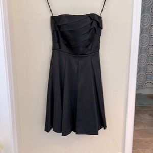 White House Black Market black satin sleeveless dress.